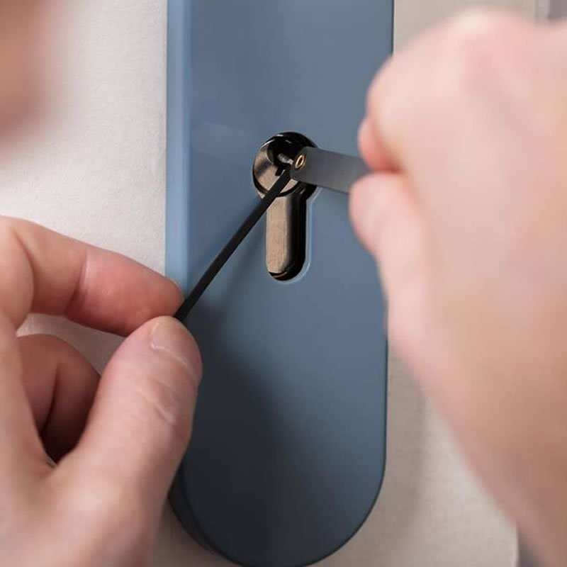 locksmith picking a door lock