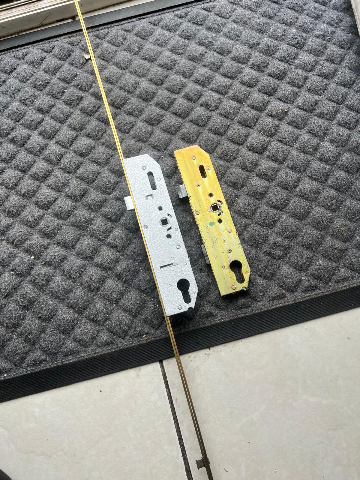 Failed uPVC door gearbox beside the replacement fitted by a Sheffield locksmith