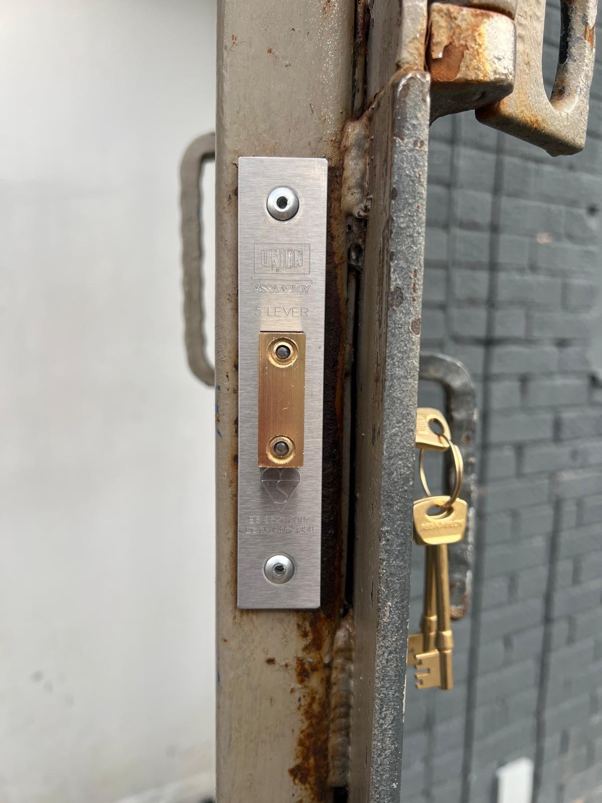 Lock change on a metal door in Sheffield by a local locksmith