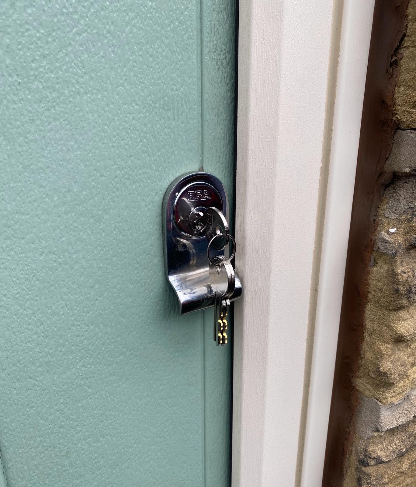ERA rim cylinder fitted to a green composite door by a locksmith in Chapeltown, Sheffield